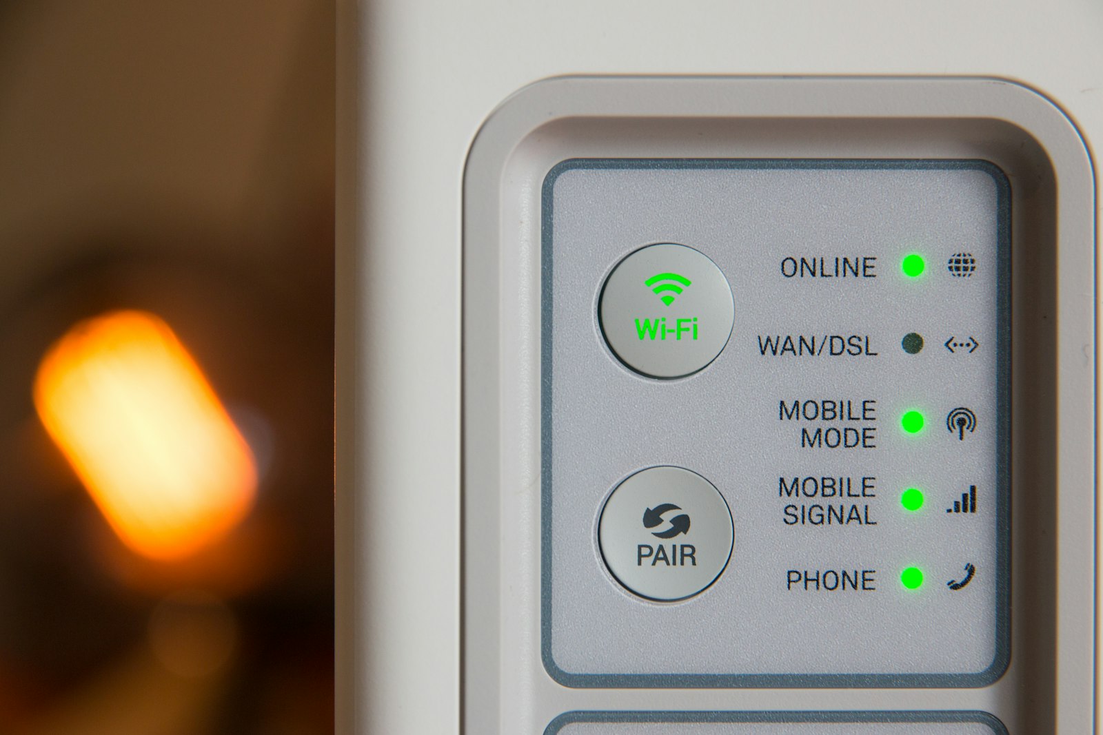 A white Wi-Fi router with a cable plugged in