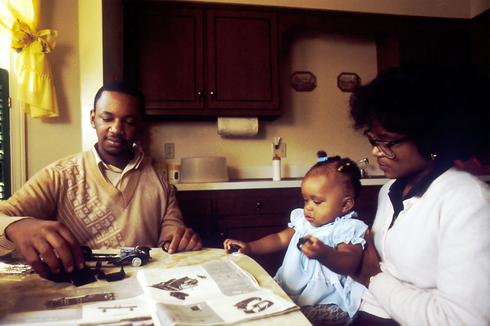A family sitting together at a kitchen table